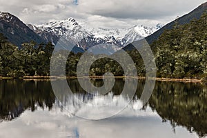 Souther Alps peaks reflecting in lake in New Zealand photo