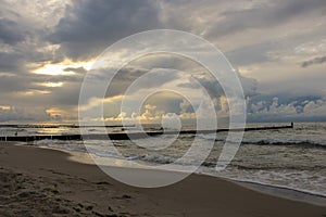 Souther Baltic sea coast, Northern Poland, Pomerania, sandy beach, dramatic sky, late winter time