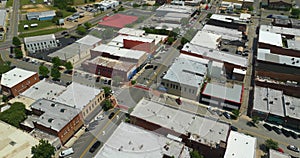 Southern architecture and Main street traffic in Tifton GA. Small town America downtown with narrow driveways and flat