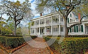 Southern Mansion with brick walkway photo