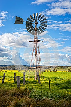 Southern Cross windmill in a rural field with crops