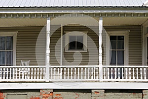 southern house porch abandoned empty old vintage entrance overhang fence covered door window retro style home architecture