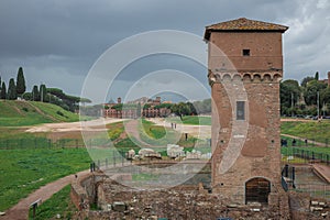 Southern part of Circo Massimo in italy with torre della Moletta tower rising from the ground. Circus maximus was the biggest photo