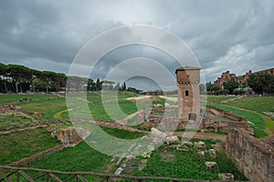 Southern part of Circo Massimo in italy with torre della Moletta tower rising from the ground. Circus maximus was the biggest photo