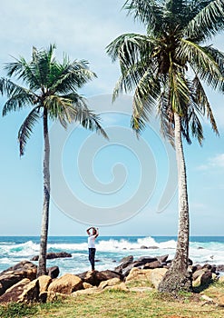 Southern point Sri Lanka island - Dondra cape, woman looks on pa