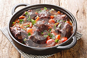 Southern Spain food Rabo de Toro Oxtail Stew with red wine closeup on a pot. Horizontal