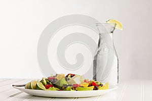 Southwest Salad next to old milk jug filled with water