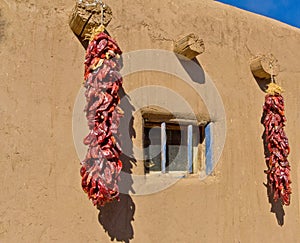 Southwestern Adobe Dwelling and Chilies photo