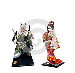 Souvenir of Asian geisha doll dress in kimono and Traditional Japanese warrior doll on white