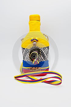 Souvenir bottle with Colombian flag pattern