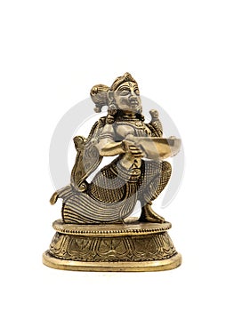 a souvenir gold statue of a goddess holding and offering a bowl of holy water