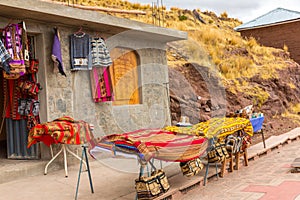 Souvenir market near towers in Sillustani, Peru,South America. Street shop with colorful blanket