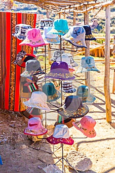 Souvenir market on street of Ollantaytambo,Peru,South America. Colorful blanket, cap, scarf, cloth, poncho