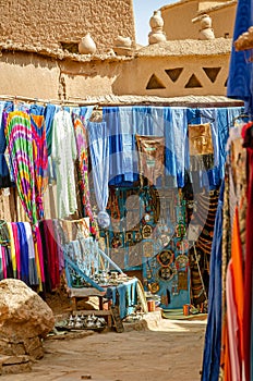 Souvenir shop and chilabas at the Kasbah Ait Ben Haddou in Ouarzazate, Morocco October 2019