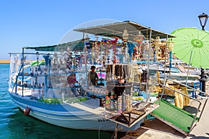 Souvenir shop, organised on fishing boat at port of Chania