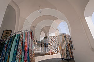 Souvenir tent with the pottery, magnets and dresses in Tashkent, Uzbekistan