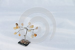Souvenir a tree on snow photo