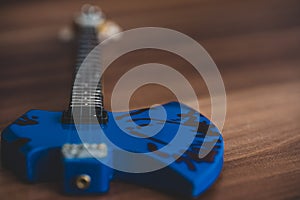 Souvenirs, electric guitar on a wooden background