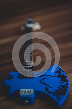 Souvenirs, electric guitar on a wooden background