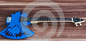 Souvenirs, electric guitar on a wooden background