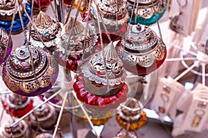 Souvenirs exhibited in market shops of the old town Mutrah. Oman. Arabian Peninsula.