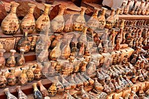 Souvenirs in Jordan, bottles with sand and shapes of desert and camels