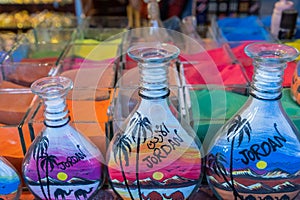Souvenirs from Jordan - bottles with sand and shapes of desert and camels