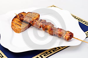 Souvlaki or kebab, grilled meat with bread, white