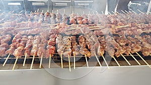 Souvlaki or suvlaki on grilling on the fire many with smoke traditiona greek stree food