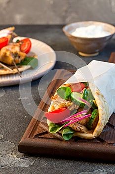 Souvlaki with vegetables wrapped in pita