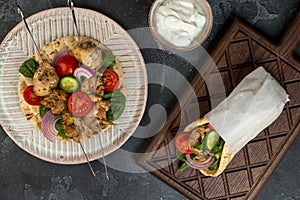 Souvlaki with vegetables wrapped in pita