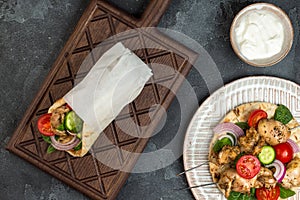 Souvlaki with vegetables wrapped in pita