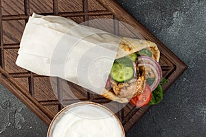 Souvlaki with vegetables wrapped in pita