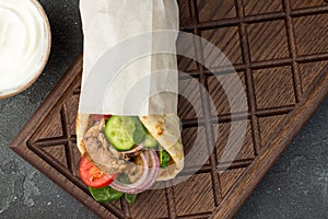 Souvlaki with vegetables wrapped in pita