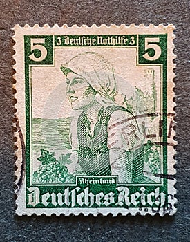 SOVATA, ROMANIA - Jul 02, 2020: old German stamp from 1935 with the image of a woman in a national costume