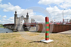 SOVETSK, RUSSIA. Boundary post against the background of the bridge of the queen Louise. Kaliningrad region