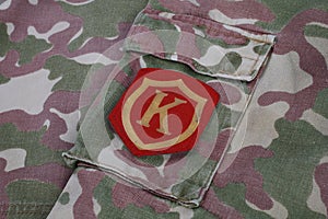 Soviet Army Commandant shoulder patch on camouflage uniform background