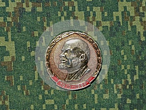 Soviet badge depicting Vladimir Ilyich Lenin Ulyanov from the collections `Vladimir Lenin`. Closeup. Faleristics.