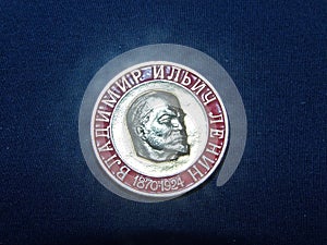 Soviet badge depicting Vladimir Ilyich Lenin Ulyanov with the inscription in Russian `Lenin, 1870-1924`