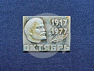 Soviet badge depicting Vladimir Ilyich Lenin Ulyanov with the inscription in Russian `October, 1917-1977`