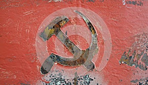 Soviet Communist hammer and sickle rusted red and black