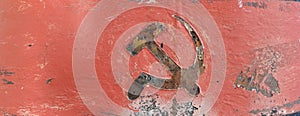 Soviet Communist hammer and sickle rusted red and black