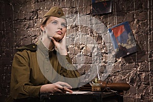 Soviet female soldier in uniform of World War II dreams