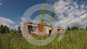 Soviet kolkhoz collective farm ruins on meadow. 4K