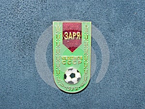 Soviet metal badge with the inscription `Zarya Voroshilovgrad the champion of the USSR and the year of victory`