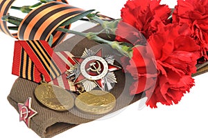 Soviet military cap with red flowers, Saint George ribbon, medals of Great Patriotic war