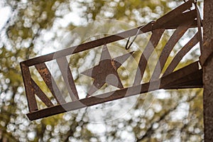 Soviet star rusted sign on the pillar at the ghost town Chernobyl