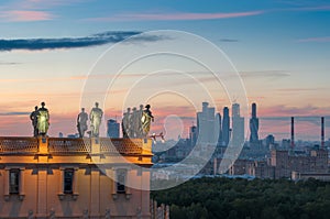 Soviet statues on the roof of building and photo