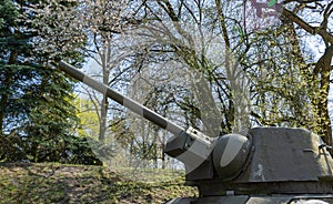 Soviet T34 tank under blue sky.