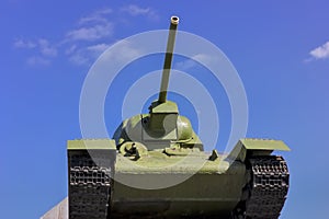 Soviet tank T-34 at war in the second world war on a blue sky background